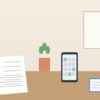 履歴書とスマートフォンのカレンダー、ノートが置かれた机のイラスト