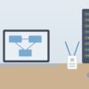 ノートパソコンとサーバーラックが置かれた社内の情報システム部門の机のイラスト