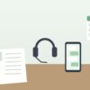 履歴書とヘッドセットとスマートフォンが置かれた机のイラスト